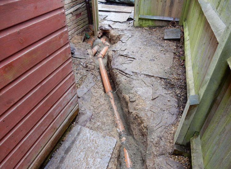 Garden Drainage Great Bookham, Leatherhead, Surrey - An ongoing issue with excessive water finding its way into the cellar of this clients property puting pressure on already installed sump pumps. Perimeter drainage was installed to catch and divert the flow of water helping to reduce the required constant use of the installed pumps. Garden Drainage - MDB Landscapes