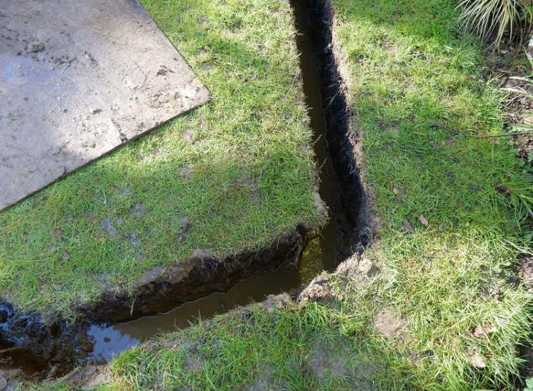 Garden Drainage Great Bookham, Leatherhead, Surrey - An ongoing issue with excessive water finding its way into the cellar of this clients property puting pressure on already installed sump pumps. Perimeter drainage was installed to catch and divert the flow of water helping to reduce the required constant use of the installed pumps. Garden Drainage - MDB Landscapes