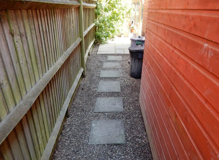 Garden Drainage Great Bookham, Leatherhead, Surrey - An ongoing issue with excessive water finding its way into the cellar of this clients property puting pressure on already installed sump pumps. Perimeter drainage was installed to catch and divert the flow of water helping to reduce the required constant use of the installed pumps. Garden Drainage - MDB Landscapes