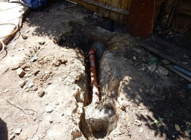 Garden and Lawn Drainage London, SW2 - A small rear garden in London struggling with constant water ingress from higher ground creating an unusable lawn area through out the year. A simple gravity fed land drainage system was installed. Garden Drainage - MDB Landscapes