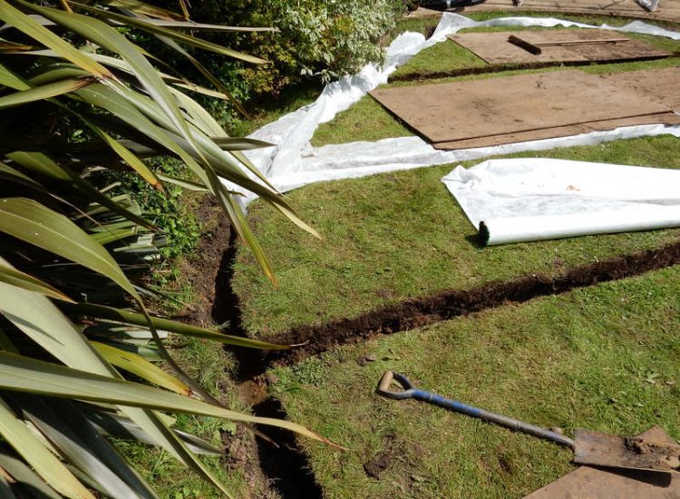 Garden and Lawn Drainage London, SW2 - A small rear garden in London struggling with constant water ingress from higher ground creating an unusable lawn area through out the year. A simple gravity fed land drainage system was installed. Garden Drainage - MDB Landscapes