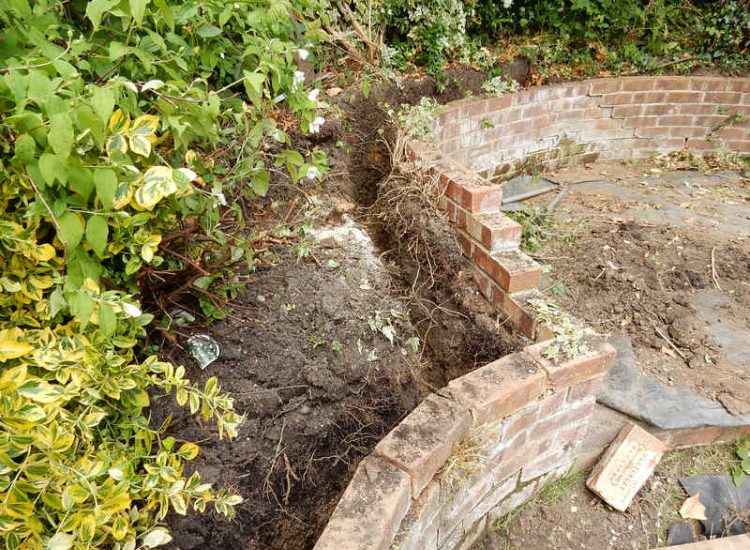 Garden and Lawn Drainage London, SW2 - A small rear garden in London struggling with constant water ingress from higher ground creating an unusable lawn area through out the year. A simple gravity fed land drainage system was installed. Garden Drainage - MDB Landscapes