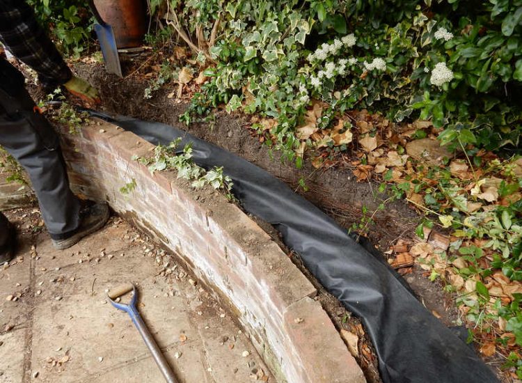 Garden and Lawn Drainage London, SW2 - A small rear garden in London struggling with constant water ingress from higher ground creating an unusable lawn area through out the year. A simple gravity fed land drainage system was installed. Garden Drainage - MDB Landscapes