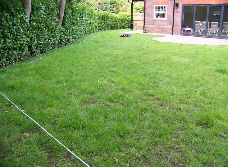 Garden Drainage and New Lawns Claygate, Surrey - A poor soil medium with bad drainage left this garden very difficault to manage and use. Levels were reduced first allowing for the installation of a drainage sytsem followed by a new lawn laid upon new imported soil. Other works here included play areas for the children, tree protection and the raising of Laural hedging due to subsidence. Garden Drainage - MDB Landscapes