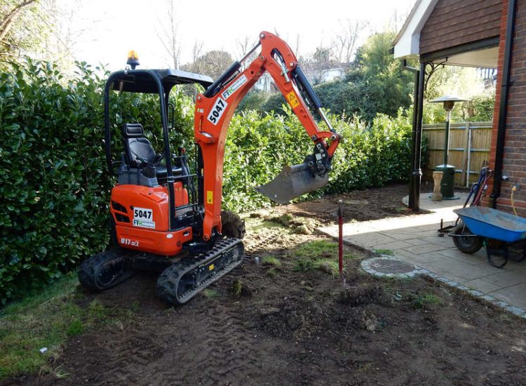 Garden Drainage and New Lawns Claygate, Surrey - A poor soil medium with bad drainage left this garden very difficault to manage and use. Levels were reduced first allowing for the installation of a drainage sytsem followed by a new lawn laid upon new imported soil. Other works here included play areas for the children, tree protection and the raising of Laural hedging due to subsidence. Garden Drainage - MDB Landscapes