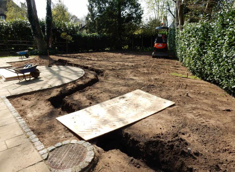 Garden Drainage and New Lawns Claygate, Surrey - A poor soil medium with bad drainage left this garden very difficault to manage and use. Levels were reduced first allowing for the installation of a drainage sytsem followed by a new lawn laid upon new imported soil. Other works here included play areas for the children, tree protection and the raising of Laural hedging due to subsidence. Garden Drainage - MDB Landscapes