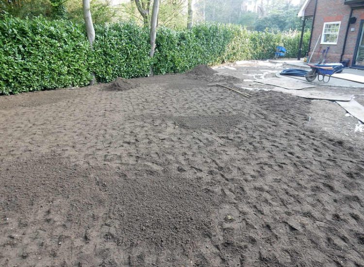 Garden Drainage and New Lawns Claygate, Surrey - A poor soil medium with bad drainage left this garden very difficault to manage and use. Levels were reduced first allowing for the installation of a drainage sytsem followed by a new lawn laid upon new imported soil. Other works here included play areas for the children, tree protection and the raising of Laural hedging due to subsidence. Garden Drainage - MDB Landscapes