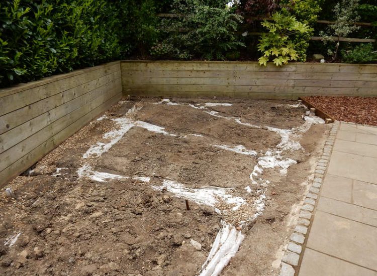 Garden Drainage and New Lawns Claygate, Surrey - A poor soil medium with bad drainage left this garden very difficault to manage and use. Levels were reduced first allowing for the installation of a drainage sytsem followed by a new lawn laid upon new imported soil. Other works here included play areas for the children, tree protection and the raising of Laural hedging due to subsidence. Garden Drainage - MDB Landscapes