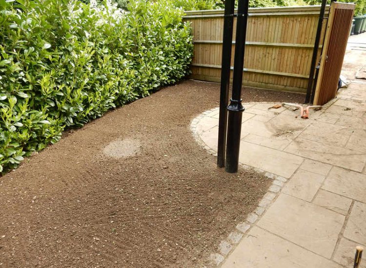 Garden Drainage and New Lawns Claygate, Surrey - A poor soil medium with bad drainage left this garden very difficault to manage and use. Levels were reduced first allowing for the installation of a drainage sytsem followed by a new lawn laid upon new imported soil. Other works here included play areas for the children, tree protection and the raising of Laural hedging due to subsidence. Garden Drainage - MDB Landscapes