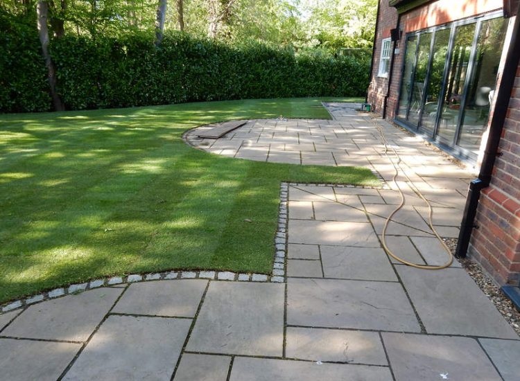 Garden Drainage and New Lawns Claygate, Surrey - A poor soil medium with bad drainage left this garden very difficault to manage and use. Levels were reduced first allowing for the installation of a drainage sytsem followed by a new lawn laid upon new imported soil. Other works here included play areas for the children, tree protection and the raising of Laural hedging due to subsidence. Garden Drainage - MDB Landscapes