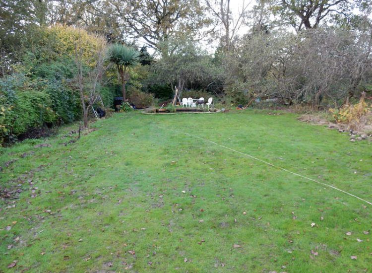 Garden Drainage and New High Specification Lawn Guildford, Surrey - To achieve the requirement of a new lawn extensive drainage was installed via the use of a sump and pump, lawn area was raised with Oak sleeper edging and finally a new lawn laid upon a high end rootzone medium. Garden drainage - MDB Landscapes