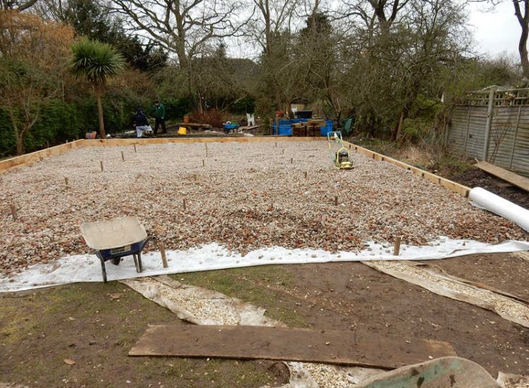 Garden Drainage and New High Specification Lawn Guildford, Surrey - To achieve the requirement of a new lawn extensive drainage was installed via the use of a sump and pump, lawn area was raised with Oak sleeper edging and finally a new lawn laid upon a high end rootzone medium. Garden drainage - MDB Landscapes