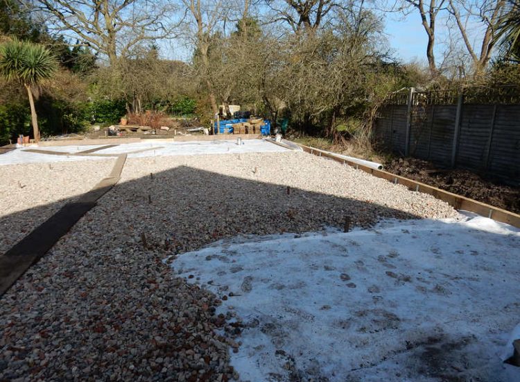 Garden Drainage and New High Specification Lawn Guildford, Surrey - To achieve the requirement of a new lawn extensive drainage was installed via the use of a sump and pump, lawn area was raised with Oak sleeper edging and finally a new lawn laid upon a high end rootzone medium. Garden drainage - MDB Landscapes
