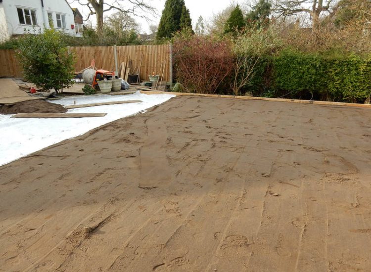 Garden Drainage and New High Specification Lawn Guildford, Surrey - To achieve the requirement of a new lawn extensive drainage was installed via the use of a sump and pump, lawn area was raised with Oak sleeper edging and finally a new lawn laid upon a high end rootzone medium. Garden drainage - MDB Landscapes