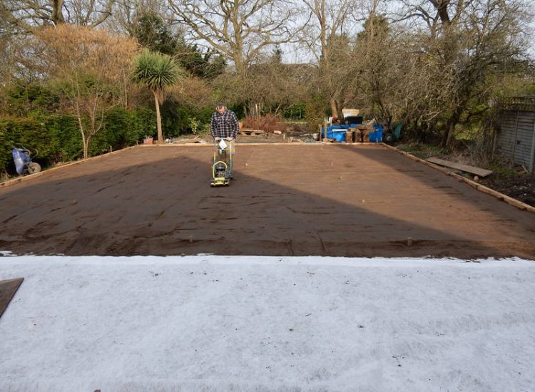 Garden Drainage and New High Specification Lawn Guildford, Surrey - To achieve the requirement of a new lawn extensive drainage was installed via the use of a sump and pump, lawn area was raised with Oak sleeper edging and finally a new lawn laid upon a high end rootzone medium. Garden drainage - MDB Landscapes