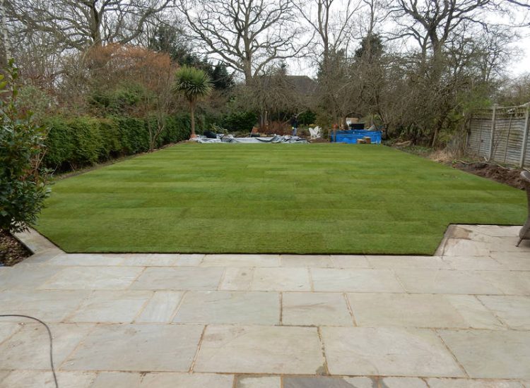 Garden Drainage and New High Specification Lawn Guildford, Surrey - To achieve the requirement of a new lawn extensive drainage was installed via the use of a sump and pump, lawn area was raised with Oak sleeper edging and finally a new lawn laid upon a high end rootzone medium. Garden drainage - MDB Landscapes