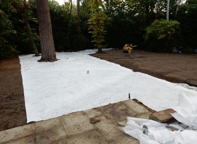 Lawn Drainage Cobham, Surrey - A poor soil medium for both front and rear gardens left lawn areas very water logged and difficult to manage. Extensive land drainage was installed, new rootzone medium imported in and lawns re-turfed. Garden Drainage - MDB Landscapes