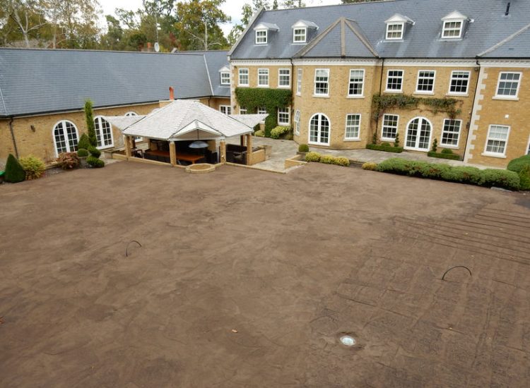 Lawn Drainage Cobham, Surrey - A poor soil medium for both front and rear gardens left lawn areas very water logged and difficult to manage. Extensive land drainage was installed, new rootzone medium imported in and lawns re-turfed. Garden Drainage - MDB Landscapes