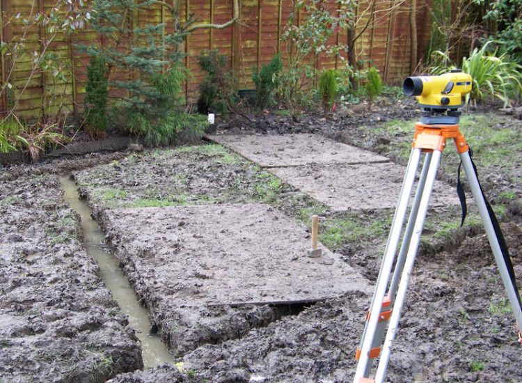 Lawn Drainage in Winchester, Hampshire - Low lawn levels and a poor soil type required the raising of levels with the use of drainage layers and land drains for this water logged garden and lawn. Imported soil was used to raise levels and all areas re-turfed. Garden Drainage - MDB Landscapes