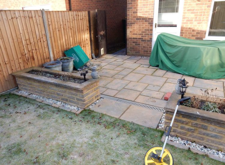 Garden and Lawn Drainage Wokingham, Berkshire - Unusable flooded planting areas, a flooded glass house and a very wet lawn prevented this client from enjoying their garden. Drainage was installed running through the glass house as well. Garden Drainage - MDB Landscapes