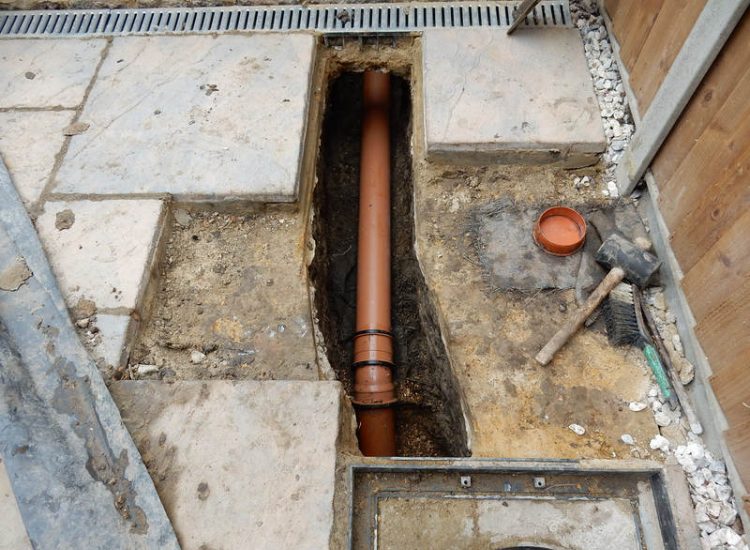 Garden and Lawn Drainage Wokingham, Berkshire - Unusable flooded planting areas, a flooded glass house and a very wet lawn prevented this client from enjoying their garden. Drainage was installed running through the glass house as well. Garden Drainage - MDB Landscapes