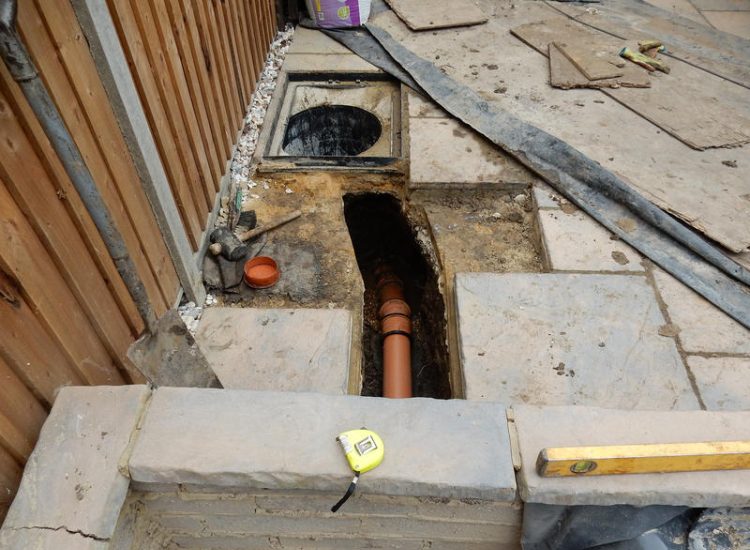 Garden and Lawn Drainage Wokingham, Berkshire - Unusable flooded planting areas, a flooded glass house and a very wet lawn prevented this client from enjoying their garden. Drainage was installed running through the glass house as well. Garden Drainage - MDB Landscapes