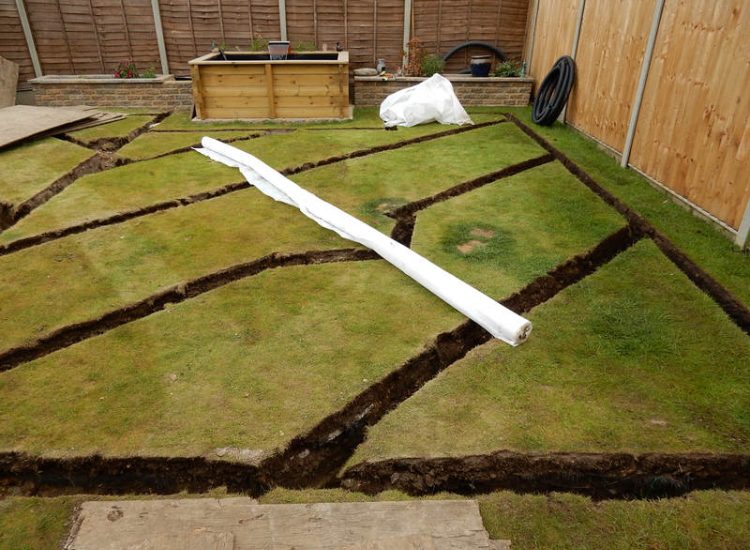 Garden and Lawn Drainage Wokingham, Berkshire - Unusable flooded planting areas, a flooded glass house and a very wet lawn prevented this client from enjoying their garden. Drainage was installed running through the glass house as well. Garden Drainage - MDB Landscapes