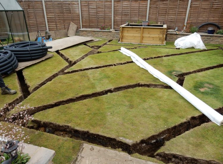 Garden and Lawn Drainage Wokingham, Berkshire - Unusable flooded planting areas, a flooded glass house and a very wet lawn prevented this client from enjoying their garden. Drainage was installed running through the glass house as well. Garden Drainage - MDB Landscapes