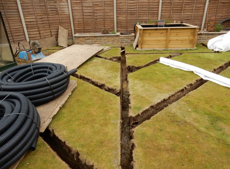 Garden and Lawn Drainage Wokingham, Berkshire - Unusable flooded planting areas, a flooded glass house and a very wet lawn prevented this client from enjoying their garden. Drainage was installed running through the glass house as well. Garden Drainage - MDB Landscapes