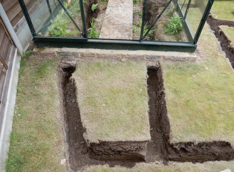 Garden and Lawn Drainage Wokingham, Berkshire - Unusable flooded planting areas, a flooded glass house and a very wet lawn prevented this client from enjoying their garden. Drainage was installed running through the glass house as well. Garden Drainage - MDB Landscapes