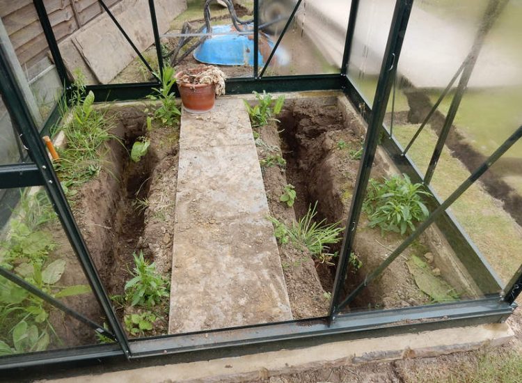 Garden and Lawn Drainage Wokingham, Berkshire - Unusable flooded planting areas, a flooded glass house and a very wet lawn prevented this client from enjoying their garden. Drainage was installed running through the glass house as well. Garden Drainage - MDB Landscapes