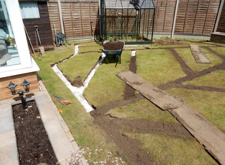 Garden and Lawn Drainage Wokingham, Berkshire - Unusable flooded planting areas, a flooded glass house and a very wet lawn prevented this client from enjoying their garden. Drainage was installed running through the glass house as well. Garden Drainage - MDB Landscapes