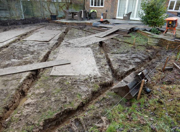 Lawns and Drainage in Guildford, Surrey - Construction of a high grade lawn using a rootzone soil medium after drainage was installed and areas raised. Lawns & Turfing - MDB Landscapes