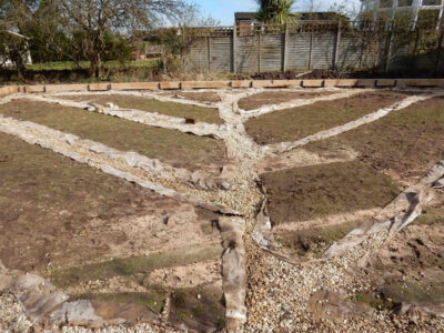 Lawns and Drainage in Guildford, Surrey - Construction of a high grade lawn using a rootzone soil medium after drainage was installed and areas raised. Lawns & Turfing - MDB Landscapes