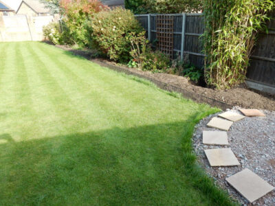 Turfing in Lightwater, Surrey - A new lawn raised to new levels, flush to new EverEdge Pro edging and paved areas. Imported soil medium a blend of topsoil, organic matter and sand. Turf used Rolawn Medallion. Lawns & Turfing - MDB Landscapes