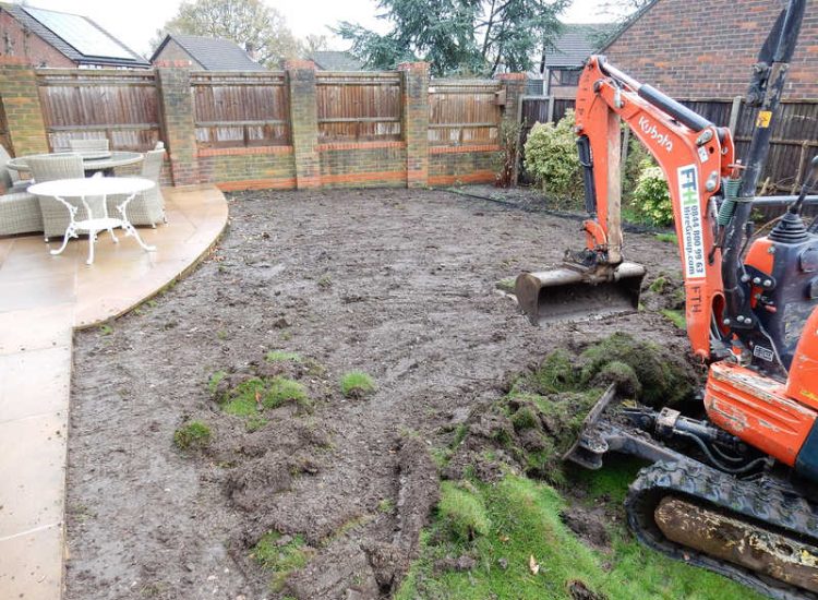 Turfing in Lightwater, Surrey - A new lawn raised to new levels, flush to new EverEdge Pro edging and paved areas. Imported soil medium a blend of topsoil, organic matter and sand. Turf used Rolawn Medallion. Lawns & Turfing - MDB Landscapes