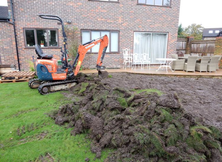 Turfing in Lightwater, Surrey - A new lawn raised to new levels, flush to new EverEdge Pro edging and paved areas. Imported soil medium a blend of topsoil, organic matter and sand. Turf used Rolawn Medallion. Lawns & Turfing - MDB Landscapes