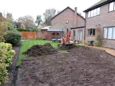 Turfing in Lightwater, Surrey - A new lawn raised to new levels, flush to new EverEdge Pro edging and paved areas. Imported soil medium a blend of topsoil, organic matter and sand. Turf used Rolawn Medallion. Lawns & Turfing - MDB Landscapes