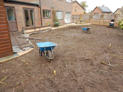 Turfing in Lightwater, Surrey - A new lawn raised to new levels, flush to new EverEdge Pro edging and paved areas. Imported soil medium a blend of topsoil, organic matter and sand. Turf used Rolawn Medallion. Lawns & Turfing - MDB Landscapes