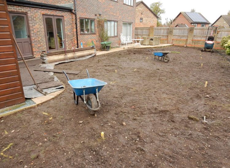 Turfing in Lightwater, Surrey - A new lawn raised to new levels, flush to new EverEdge Pro edging and paved areas. Imported soil medium a blend of topsoil, organic matter and sand. Turf used Rolawn Medallion. Lawns & Turfing - MDB Landscapes