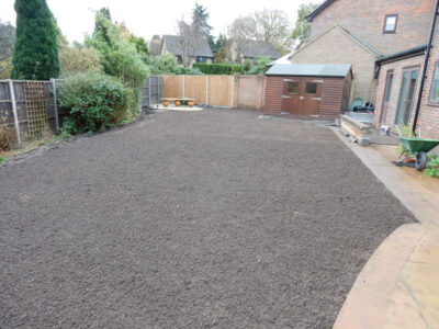 Turfing in Lightwater, Surrey - A new lawn raised to new levels, flush to new EverEdge Pro edging and paved areas. Imported soil medium a blend of topsoil, organic matter and sand. Turf used Rolawn Medallion. Lawns & Turfing - MDB Landscapes