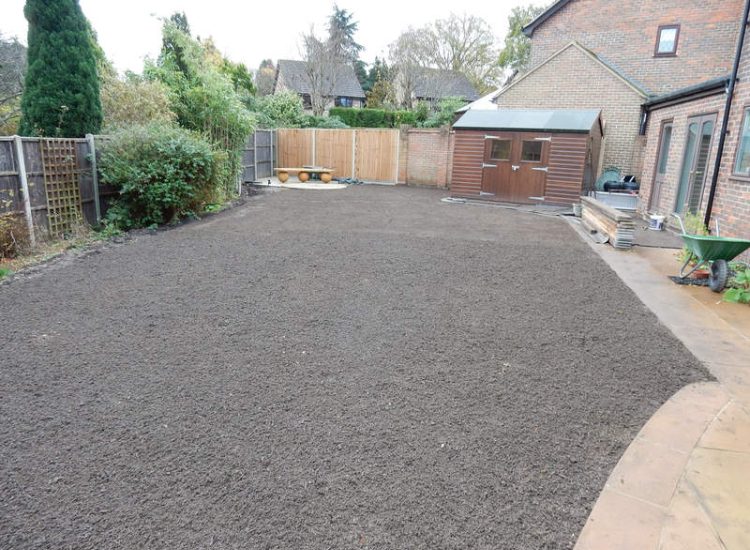 Turfing in Lightwater, Surrey - A new lawn raised to new levels, flush to new EverEdge Pro edging and paved areas. Imported soil medium a blend of topsoil, organic matter and sand. Turf used Rolawn Medallion. Lawns & Turfing - MDB Landscapes