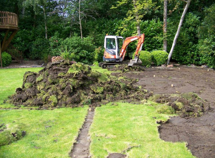 Lawn Construction in Oxshott, Surrey - Large areas of garden lawns struggling with drainage issues. Areas reduced in levels first, land drainage installed followed by the importaion of rootzone and completed areas re-turfed. Lawns & Turfing - MDB Landscapes