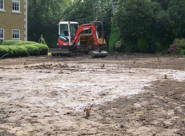 Lawn Construction in Oxshott, Surrey - Large areas of garden lawns struggling with drainage issues. Areas reduced in levels first, land drainage installed followed by the importaion of rootzone and completed areas re-turfed. Lawns & Turfing - MDB Landscapes