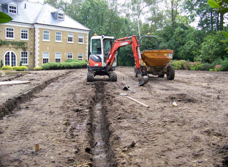 Lawn Construction in Oxshott, Surrey - Large areas of garden lawns struggling with drainage issues. Areas reduced in levels first, land drainage installed followed by the importaion of rootzone and completed areas re-turfed. Lawns & Turfing - MDB Landscapes