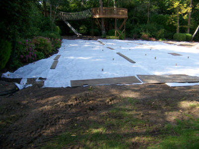 Lawn Construction in Oxshott, Surrey - Large areas of garden lawns struggling with drainage issues. Areas reduced in levels first, land drainage installed followed by the importaion of rootzone and completed areas re-turfed. Lawns & Turfing - MDB Landscapes