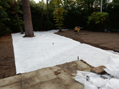 Lawn Construction in Oxshott, Surrey - Large areas of garden lawns struggling with drainage issues. Areas reduced in levels first, land drainage installed followed by the importaion of rootzone and completed areas re-turfed. Lawns & Turfing - MDB Landscapes