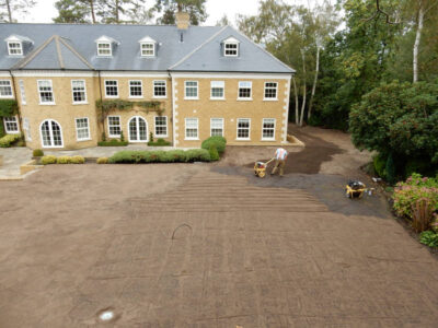 Lawn Construction in Oxshott, Surrey - Large areas of garden lawns struggling with drainage issues. Areas reduced in levels first, land drainage installed followed by the importaion of rootzone and completed areas re-turfed. Lawns & Turfing - MDB Landscapes