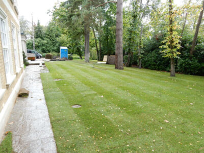 Lawn Construction in Oxshott, Surrey - Large areas of garden lawns struggling with drainage issues. Areas reduced in levels first, land drainage installed followed by the importaion of rootzone and completed areas re-turfed. Lawns & Turfing - MDB Landscapes