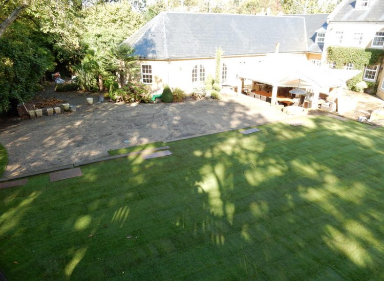 Lawn Construction in Oxshott, Surrey - Large areas of garden lawns struggling with drainage issues. Areas reduced in levels first, land drainage installed followed by the importaion of rootzone and completed areas re-turfed. Lawns & Turfing - MDB Landscapes